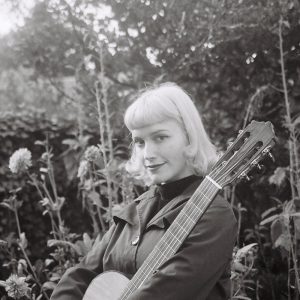 Frances Grass with guitar